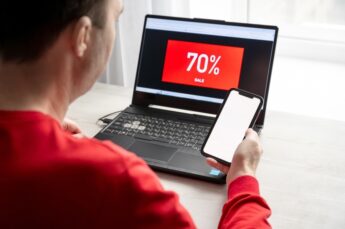 A,man,is,looking,for,a,bargain,on,a,laptop